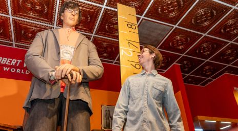 Robert Wadlow: The World's Tallest Man at Niagara Falls standing next to his wax figure