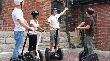 Four people taking a Segway tour